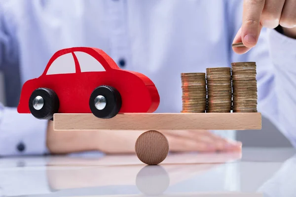 Man Hand Placing Coin Top Stack Coins Red Car Swesaw — Stock fotografie