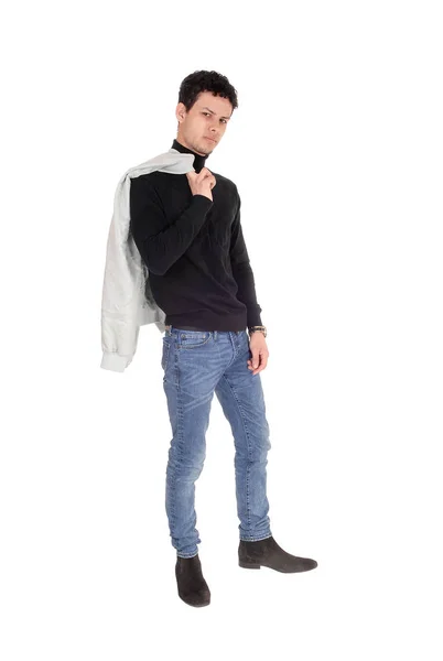 Joven Guapo Pie Suéter Negro Jeans Con Chaqueta Sobre Hombro — Foto de Stock