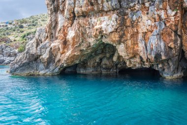 Turquoise water under Blue Caves in Zante Island, Greece clipart