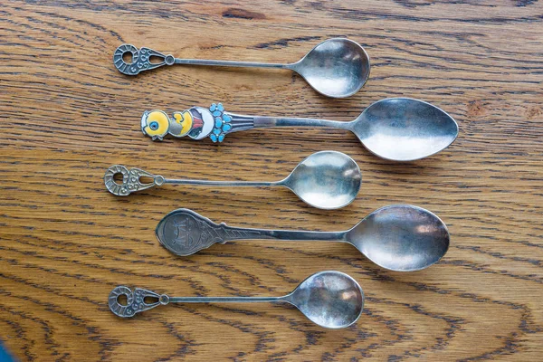 Small Antique Spoons Various Shapes Sizes Lie Oak Table — Stock Photo, Image