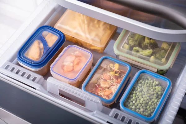 Stacked Of Plastic Containers With Various Food Store In Refrigerator