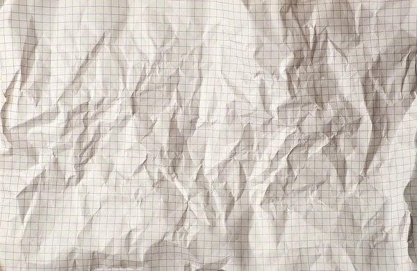 crumpled sheet of school notebook in a cage, full frame, abstract background