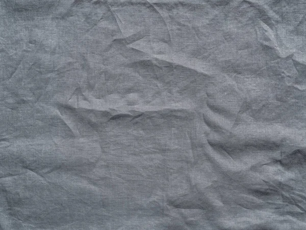 Gray linen texture as background. Gray linen crumpled tablecloth. Can use as mock up for design. Copy space for text