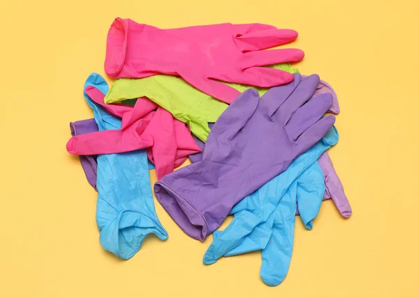 Colorful Rubber Medical Gloves Pile Yellow Background — Stock Photo, Image