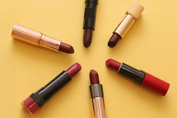 Shades Red Lipsticks Make Tubes Yellow Background — Stock Photo, Image