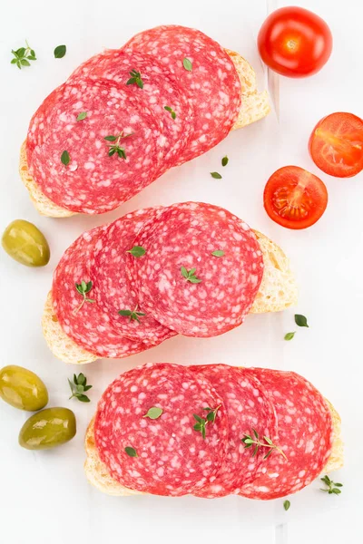 Salami Slices Thyme Ciabatta Bread Green Olives Cherry Tomatoes Side — Stock Photo, Image