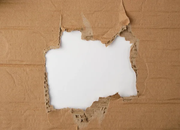 Torn Hole Brown Paper White Background Close Stock Photo