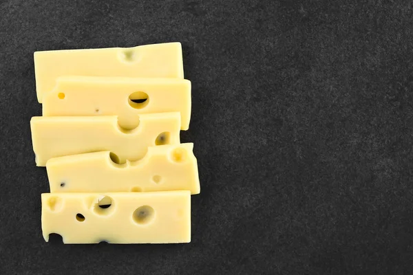 Slices Emmental Emmentaler Emmenthal Cheese Slate Photographed Overhead Copy Space — Stock Photo, Image