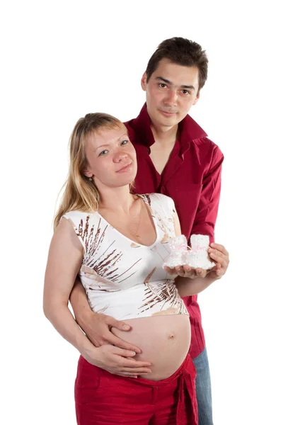 Young Family Expecting Birth Child Holds Bootees — Stock Photo, Image