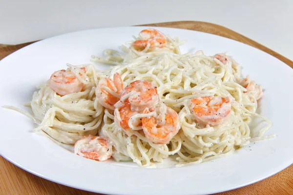shrimp with pasta on plate