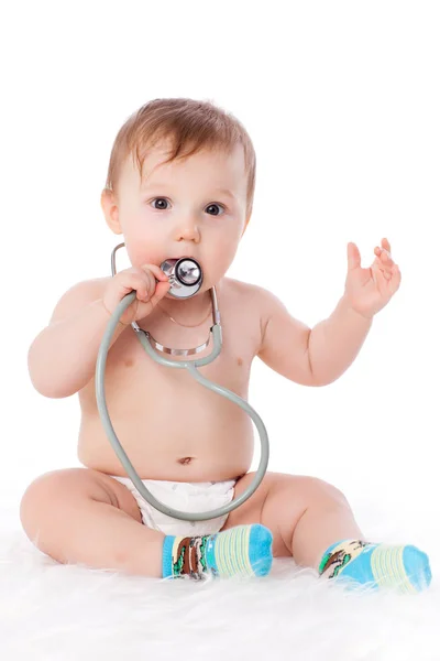 甘いです赤ちゃんとともに聴診器上の白い背景 — ストック写真