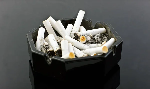 Black Ashtray Cigaretes Black Table Stock Image
