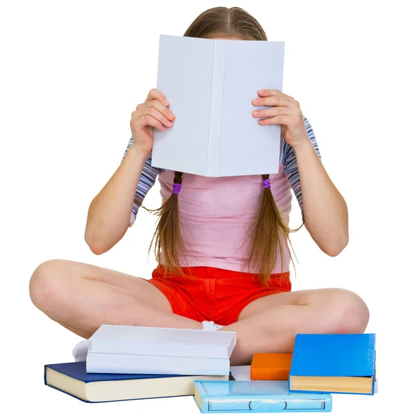 少女読書ザ本上の白い背景 — ストック写真