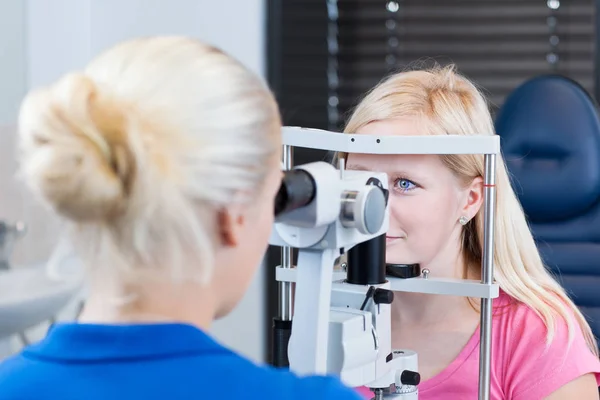 Optometry Concept Pretty Young Female Patient Having Her Eyes Examined Royalty Free Stock Photos