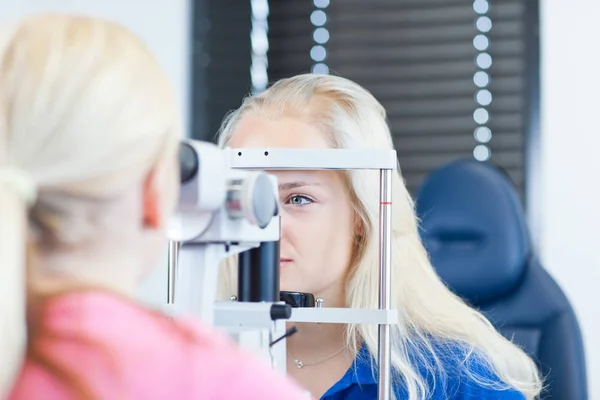 Optometry Concept Pretty Young Female Patient Having Her Eyes Examined Royalty Free Stock Photos