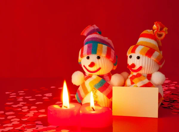 Two Snowmen Two Burning Heart Shaped Candles — Stock Photo, Image