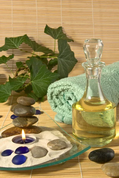 Bottle Massage Oil Burning Scented Candle Bath Towel Stones — Stock Photo, Image