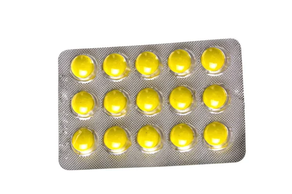 Fehér Tablettán Izolált Sárga Tabletták Csomagolása — Stock Fotó