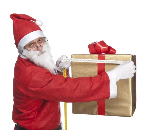Weihnachtsmann Misst Eine Geschenkschachtel — Stockfoto