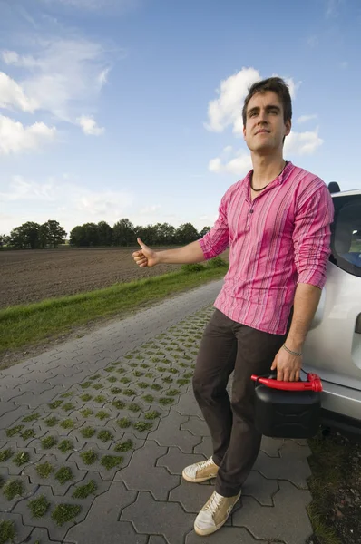 Young Man Black Jerry Cans Lonely Country Road Leaning Helplessly — Stock Photo, Image