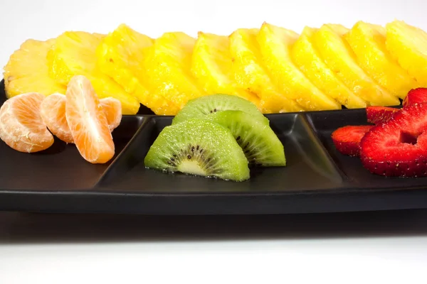 Sliced Fruits Black Saucer — Stock Photo, Image