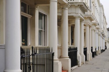 Terraced houses in Belgrave Road, Pimlico, London, England. With colonaded entrances clipart