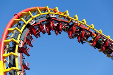 rollercoaster against blue background,attraction in the amusement park clipart