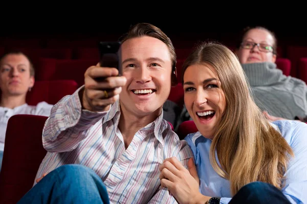 couple and other people in cinema