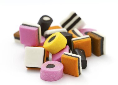 Selection of liquorice allsorts with shallow DOF clipart