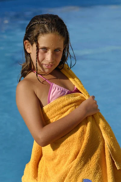 stock image Beautiful young girl posing in a pool