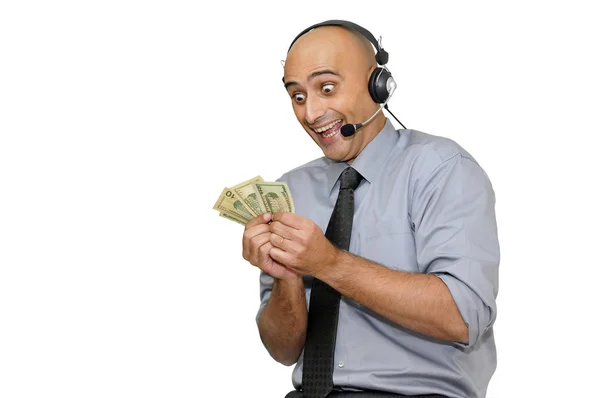 ヘッドセットと白で隔離されたお金を持つ幸せなビジネスマン — ストック写真
