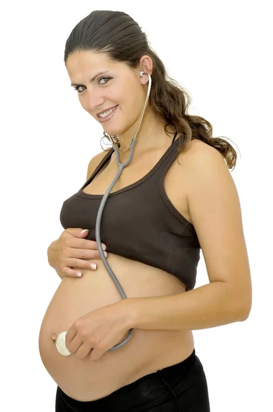 Беременная Женщина Стетоскопом Слушает Живот Изолирован Белом — стоковое фото