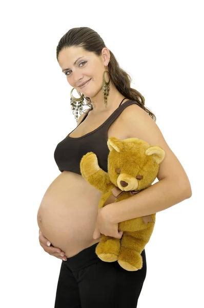 Беременная Женщина Держит Плюшевого Медведя Изолированным Белом — стоковое фото