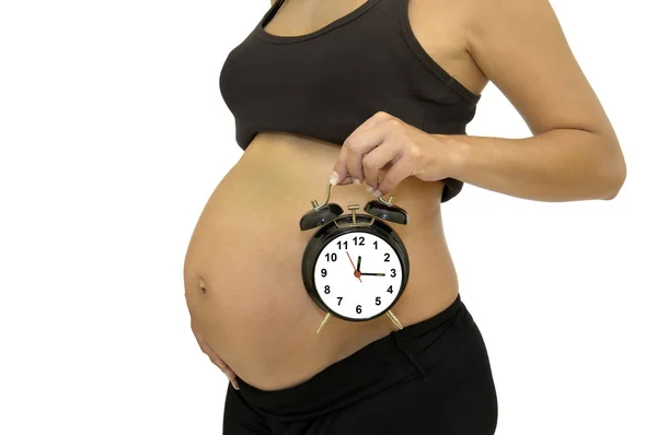 Pregnant Woman Holding Big Alarm Clock Isolated White Royalty Free Stock Photos