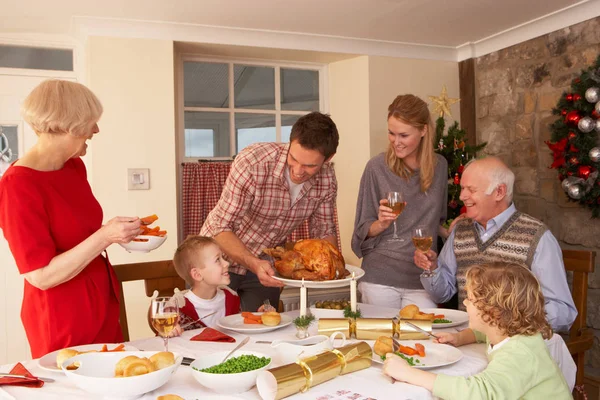 Family Serving Christmas Dinner — Stock Photo, Image