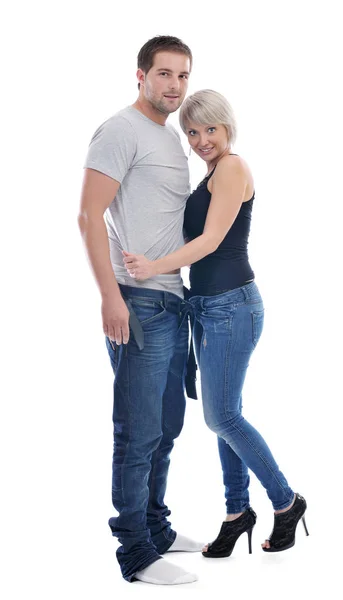ファッショナブルな下着と青いジーンズの服で白に孤立した若いカップル — ストック写真