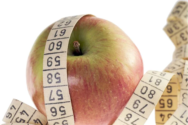 苹果和白色背景上的测量带 — 图库照片