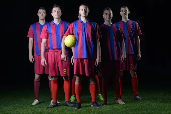 Equipo Futbolistas Aislados Sobre Fondo Negro —  Fotos de Stock