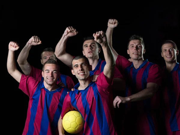 足球队队员在庆祝胜利的同时举行胜利政变 成为比赛的冠军 — 图库照片