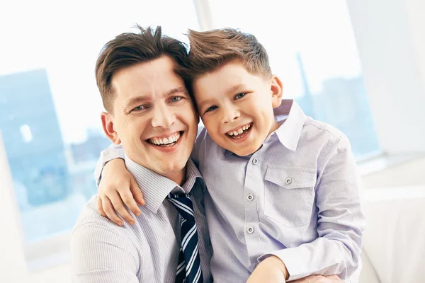 Photo Happy Man His Son Embracing Looking Camera — Stock Photo, Image