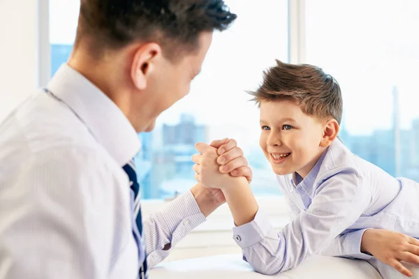 Photo Little Boy His Dad Competing Physical Strength Stock Photo