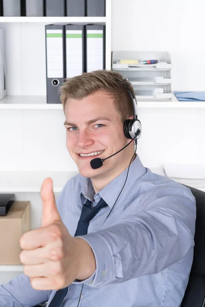 Young Man Headset Shows Thumbs — Stock Photo, Image