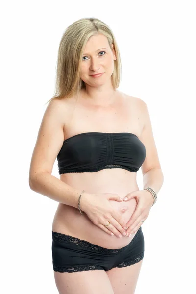 Těhotná Žena Tvořící Srdce — Stock fotografie