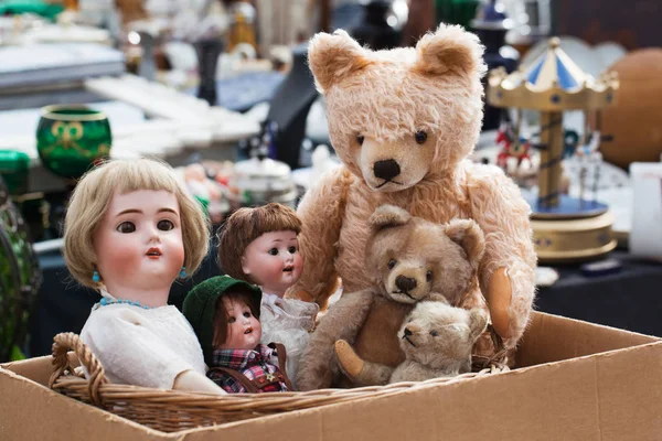 teddy bears and dolls at flea market