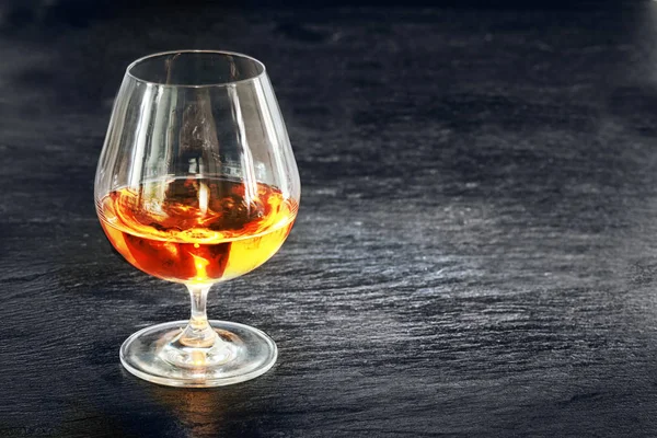 Elegant Snifter Glowing Golden Cognac Standing Rustic Dark Bar Counter — Stock Photo, Image
