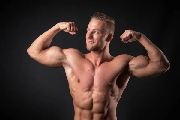 Toned Young Man Shows Poses — Stock Photo, Image