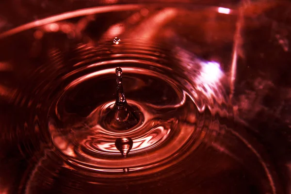 Stock image water drop on a black background