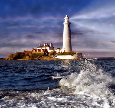 St.Mary's lighhouse beams its powerful light through the dark skyes clipart