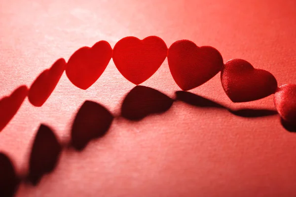 Chain Small Red Fabric Hearts Red Background —  Fotos de Stock