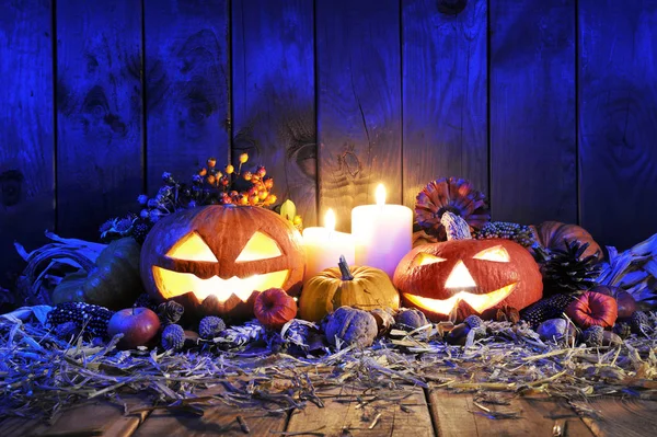 Lit Halloween Pumpkins Candles Nuts Corn Cobs Apple Straw Front — Stock Photo, Image